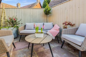 Comfortable seating in the courtyard garden