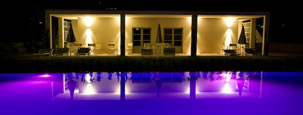 Tuscany villa with shared pool by night