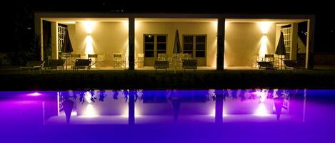 Tuscany villa with shared pool by night