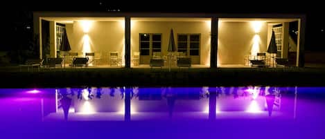 Tuscany villa with shared pool by night