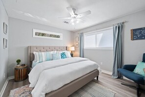 Luxurious king size bed in the master bedroom with a smart TV