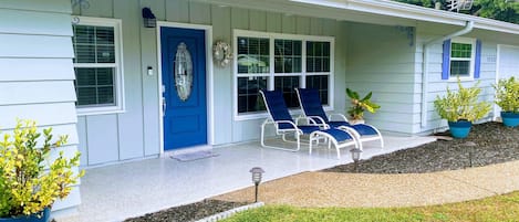 Front porch features 2 chaise loungers.  Perfect place for morning coffee!