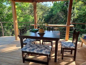 Outdoor dining under the gazebo overlooking the jungle