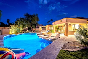 Gorgeous backyard with large pool, slide, baha shelf, kive fireplace & more!