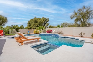 Gorgeous backyard with large pool, slide, baha shelf, kive fireplace & more!