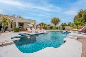 Gorgeous backyard with large pool, slide, baha shelf, kive fireplace & more!