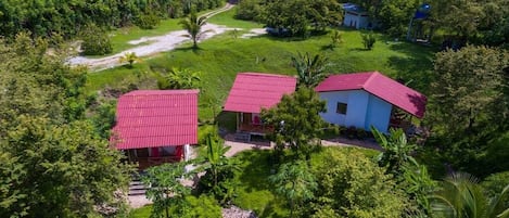 Three (3) Stand-alone 34 sq. mt bungalows, situated on 4 acres of land with intact rainforest, can be used as a perfect two-bedroom, kitchen home ideal for families and groups of friends.