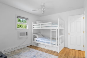 Bunk beds with storage underneath, tv in room