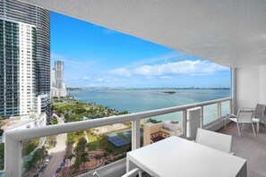 Fully furnished balcony with water views of Biscayne Bay and Margaret pace Park 