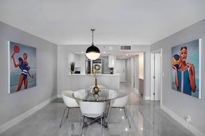 Dining area, view into fully equipped kitchen