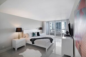 Master bedroom suite, king bed, Roku tv, balcony access, bathroom, safe