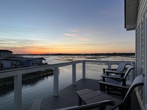 Sunset Vibes from the top deck with views of the salt marsh. What a relaxing view!