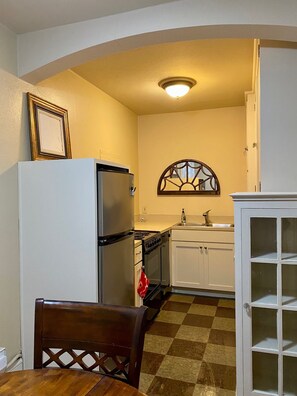 Kitchen with dishwasher & full size stove & fridge
