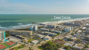 100 meters to sand, no streets to cross.  Cocoa Beach Pier is one block South