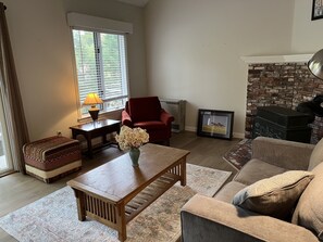 Plenty of seating in living room. Not shown is new wall-mounted television