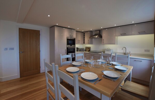 Modern kitchen with dining are spacious enough  for all guests