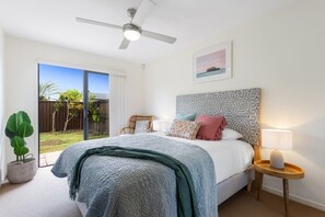 Downstairs bedroom, with ceiling fan. Opens onto the garden. Screens on door.