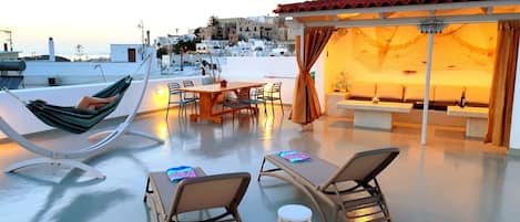 Terrace view of the castle, the temple of Apollo, port entrance and Paros.