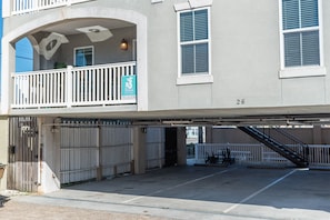 Covered Parking - Parking for two cars. Cars park behind each other. There is a height limit . The stairs and elevator are right by the parking