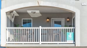 Balcony to people watchi - The Balcony overlooks some of the streets and lanes of Main Street Tybee Island.   Seating and table to relax and enjoy