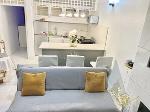 Sofa bed and kitchen 