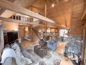 Our 22ft cathedral ceiling offers the most luxurious feel. Discover the warmth of an authentic log-home chalet interior.
