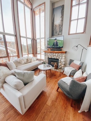 Large sectional and bright windows.