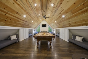 Spacious game loft with 4 twin beds—perfect for lounging, gaming & relaxing