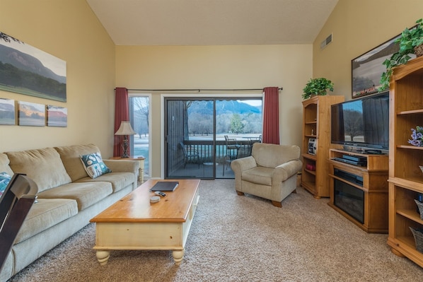 Living room looks out into small porch