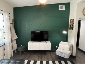 open concept living room w/ custom wall treatment