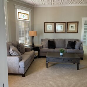Downstairs casual living room with 55” tv. 