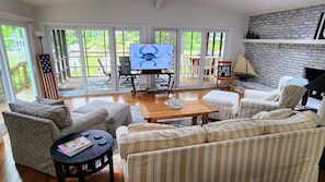 Family room with sunny western exposure - watch TV, boats, or both!