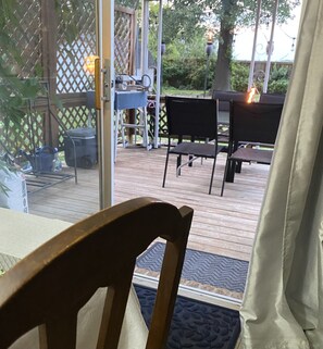 Easy in and out to the patio-deck area from the kitchen-dining area. 