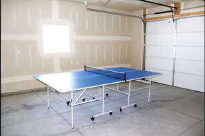 Ping pong table is in the garage, ready for fun times for all!