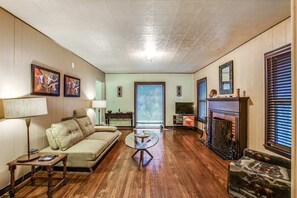 Living room- 43" Roku TV w/ Netflix & wood burning fireplace