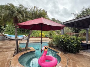 Dive into relaxation in your private backyard oasis. Back yard view in the