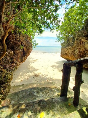 Private access to the white sand beach from Villa Camotes, Santiago.