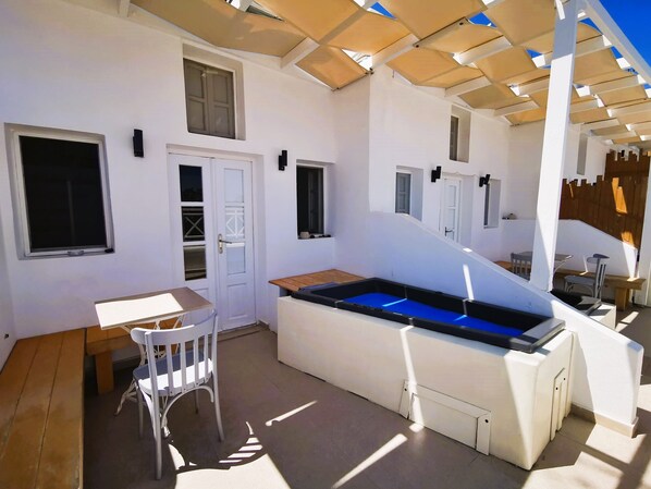 Patio with Hot Tub and small seating area