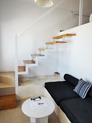 Living area and staircase to the upper bedroom