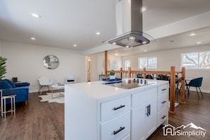 Brand new stainless steel appliances and brand new range are featured in the kitchen. 