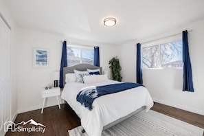 The sunlit and airy master bedroom includes an en suite bathroom for your convenience.