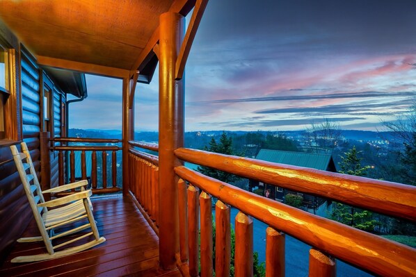 Relax on the porch and take in the beauty of a serene sunset.