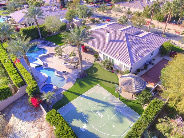 Beautiful private yard.  Basketball court was resurfaced after this was taken.