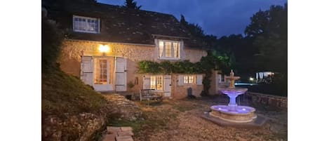 La Maison de la Grotte by night from the courtyard