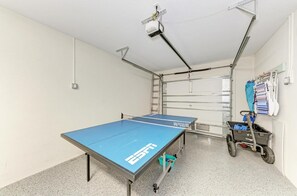 Finished garage with a ping pong table and all the beach essentials