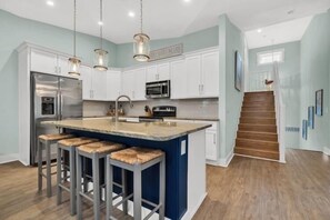 View of kitchen facing towards the split level stairway