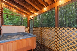 Unwind in Moonfire's enchanting private hot tub on a screened porch (no bugs!)