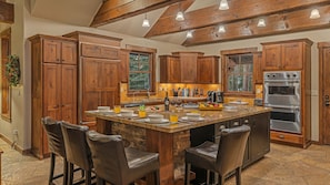 Gourmet kitchen with large island and breakfast bar seating