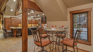 High-top bar table adjacent to the kitchen