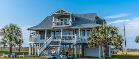 Exterior of house facing beach -- Golf cart available for rental